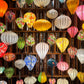 Colorful silk lanterns hanging from a ceiling