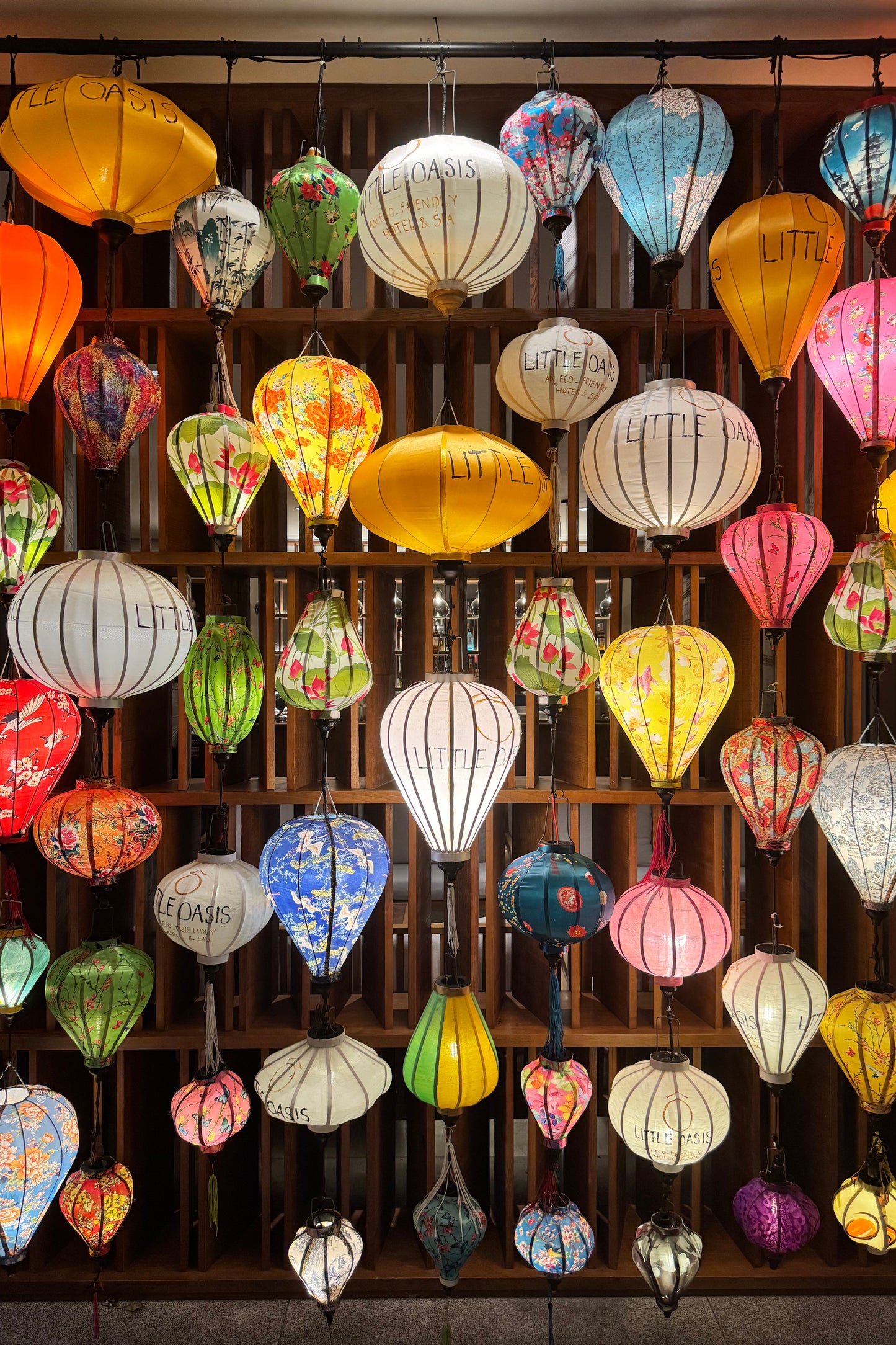Colorful silk lanterns hanging from a ceiling