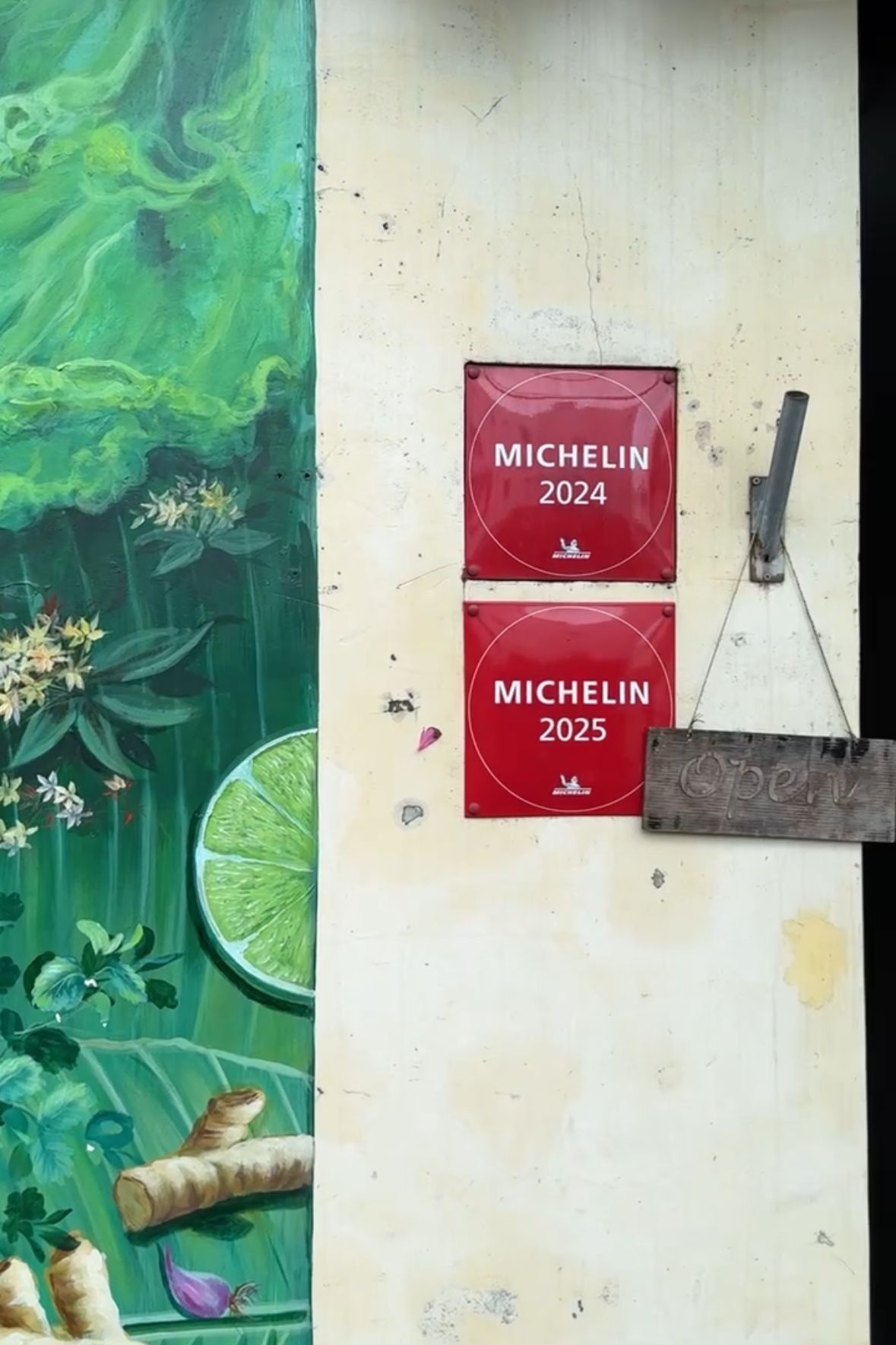 Michelin restaurant with a scenic illustration on a wooden board