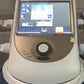 Medical device with a digital display and control panel on a gray background