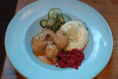Butcher shop in a food hall in Malmo Sweden a dish of Swedish Meatballs